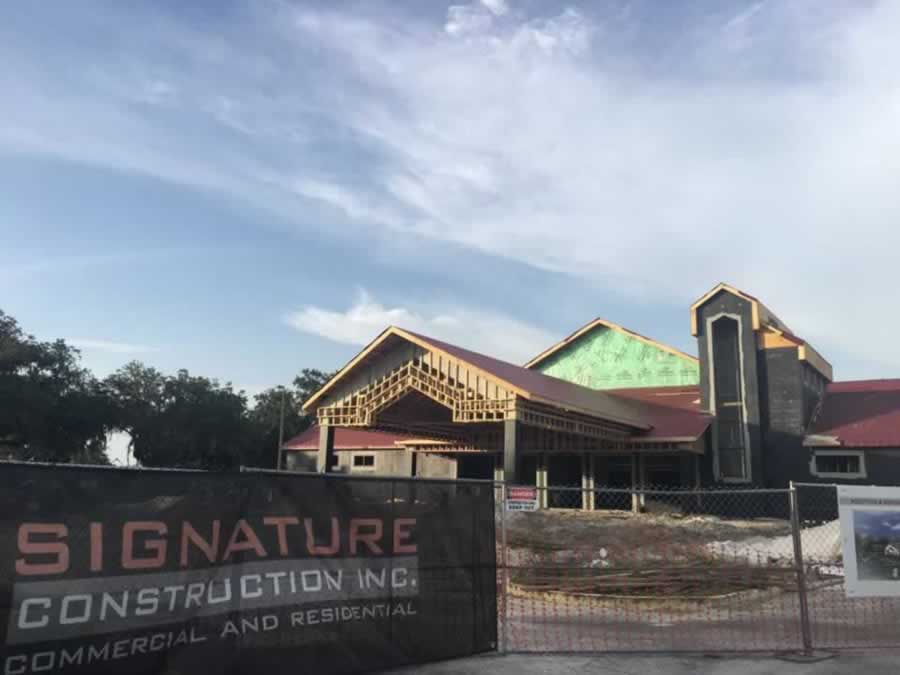 Signature Construction sign on job site.